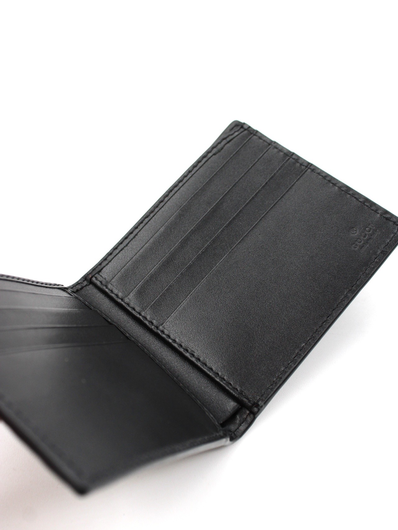 Portafoglio Gucci bifold con GG in rilievo thumb